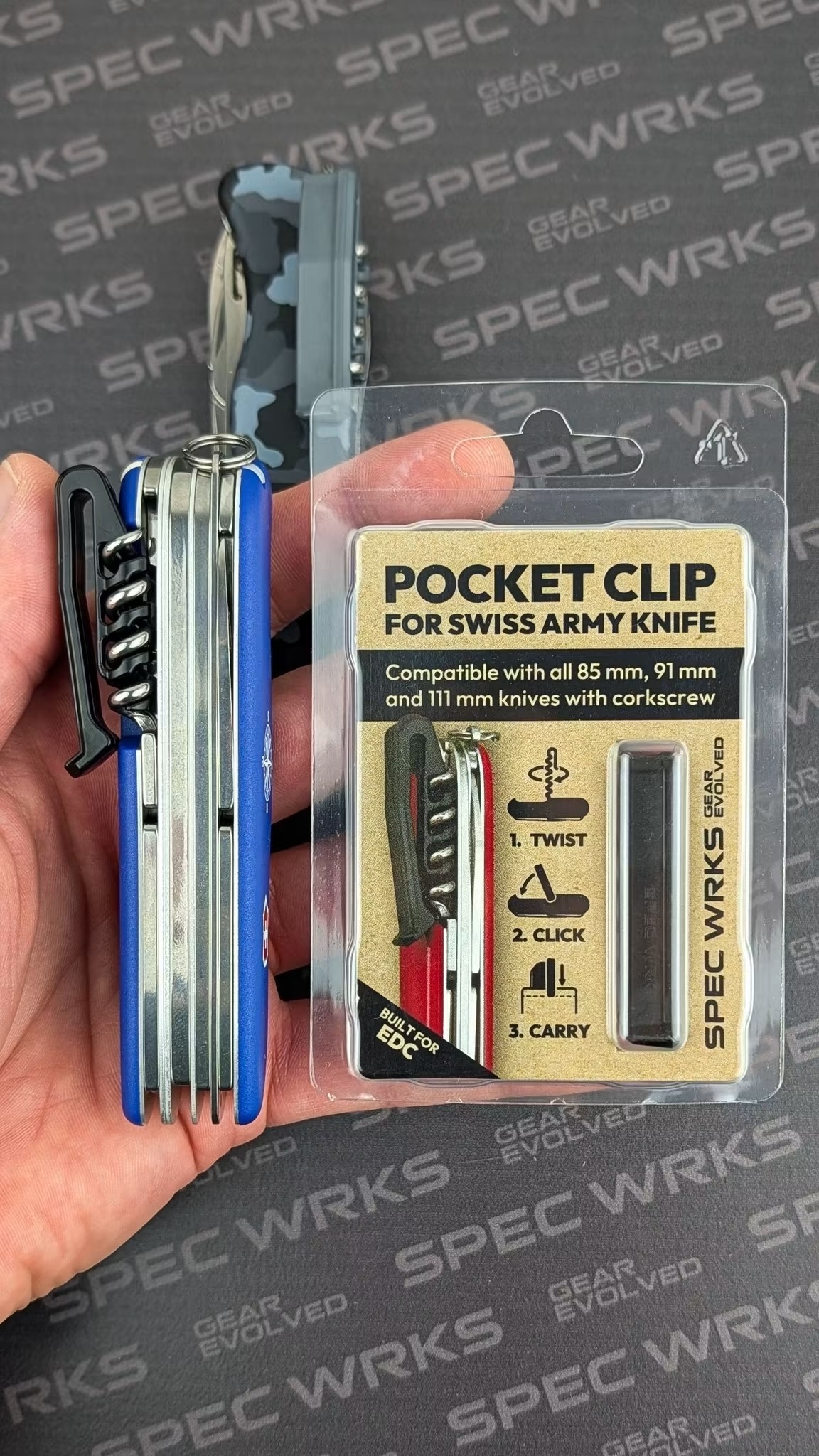 Spec Wrks Pocket Clip for Swiss Army Knife in retail packaging beside a knife with the clip fitted